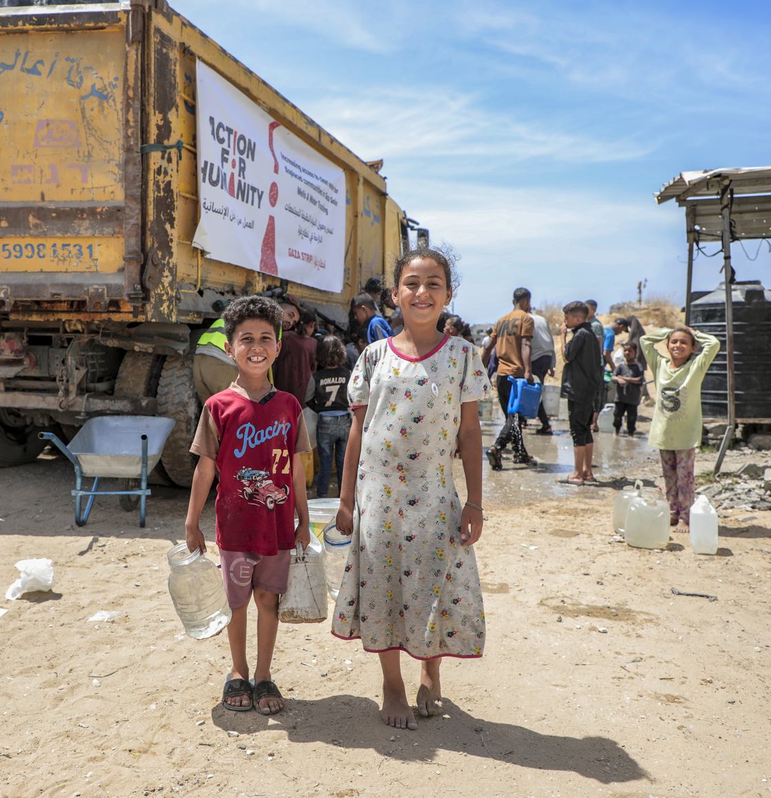 children smiling gaza water